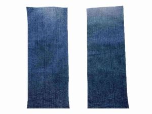 Close-up view of high-quality denim strips displaying the intricate weave, ideal for softer consistency sugaring wax applications.