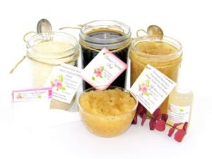 The bundle includes an 8 oz mason jar filled with firm sugaring paste, a jar of Rosemary Eucalyptus Herbal Sugar Body Scrub, and Colloidal Oatmeal Brown Sugar Dry Body Scrub, a small bottle of pure aloe vera, a pouch of cornstarch, an applicator, and a glass bowl showcasing the sugar scrub, garnished with sprinkles of rosemary and a sprig of eucalyptus.