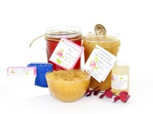 The bundle includes an 8 oz mason jar filled with soft sugaring wax, a jar of Rosemary Eucalyptus Herbal Sugar Body Scrub, the included applicator, bottle of pure aloe vera, denims strips and a glass bowl showcasing the sugar scrub, garnished with sprinkles of rosemary and a sprig of eucalyptus.