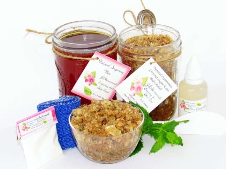 The bundle includes an 8 oz mason jar filled with soft sugaring wax, a jar of Peppermint Coconut Sugar Body Scrub, a small bottle of pure aloe vera, a pouch of cornstarch, denim strips, an applicator, and a glass bowl showcasing the sugar scrub, garnished with coconut shavings and a sprig of fresh mint.