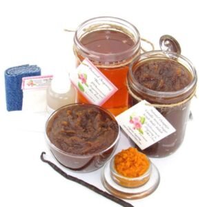 The bundle includes an 8 oz mason jar filled with soft sugaring wax, a jar of Pumpkin Vanilla Brown Sugar Body Scrub, a small bottle of pure aloe vera, a pouch of cornstarch, denim strips, an applicator, and a glass bowl showcasing the sugar scrub, garnished with a vanilla bean and pumpkin puree.