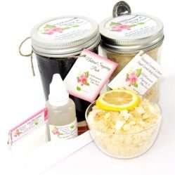 The bundle includes an 8 oz mason jar filled with firm sugaring paste, a jar of Coconut Lemon Sugar Body Scrub, a small bottle of pure aloe vera, a pouch of cornstarch, an applicator, and a glass bowl showcasing the sugar scrub, garnished with coconut shavings and a slice of lemon.