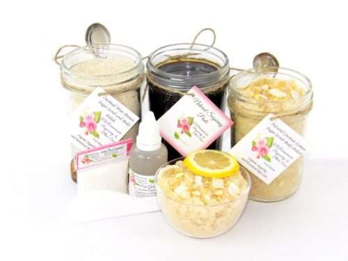 The bundle includes an 8 oz mason jar filled with firm sugaring paste, a jar of Coconut Lemon Sugar Body Scrub, and Colloidal Oatmeal Brown Sugar Dry Body Scrub, a small bottle of pure aloe vera, a pouch of cornstarch, an applicator, and a glass bowl showcasing the sugar scrub, garnished with coconut shavings and a slice of lemon.