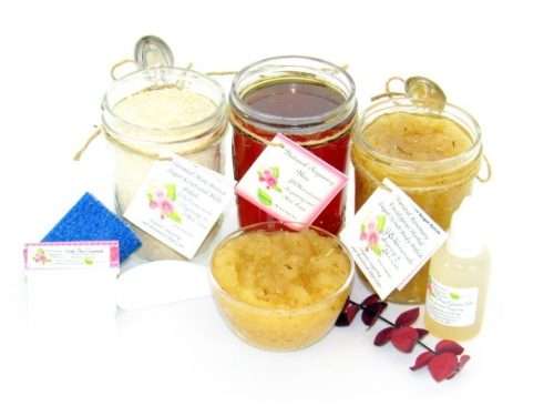 The bundle includes an 8 oz mason jar filled with soft sugaring wax, a jar of Rosemary Eucalyptus Herbal Sugar Body Scrub, and Colloidal Oatmeal Brown Sugar Dry Body Scrub, a small bottle of pure aloe vera, a pouch of cornstarch, denim strips, an applicator, and a glass bowl showcasing the sugar scrub, garnished with sprinkles of rosemary and a sprig of eucalyptus.