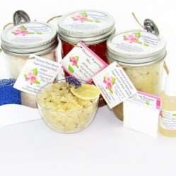 The bundle includes an 8 oz mason jar filled with soft sugaring wax, a jar of Lavender Lemon Herbal Relaxing Sugar Body Scrub, and Colloidal Oatmeal Brown Sugar Dry Body Scrub, a small bottle of pure aloe vera, a pouch of cornstarch, denim strips, an applicator, and a glass bowl showcasing the sugar scrub, garnished with a lavender sprig and a slice of lemon.