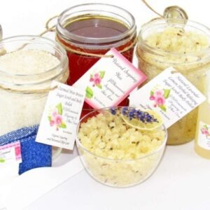 The bundle includes an 8 oz mason jar filled with soft sugaring wax, a jar of Lavender Lemon Herbal Relaxing Sugar Body Scrub, and Colloidal Oatmeal Brown Sugar Dry Body Scrub, a small bottle of pure aloe vera, a pouch of cornstarch, denim strips, an applicator, and a glass bowl showcasing the sugar scrub, garnished with a lavender sprig and a slice of lemon.