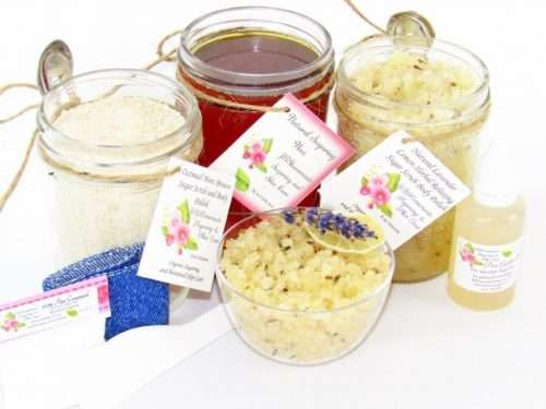 The bundle includes an 8 oz mason jar filled with soft sugaring wax, a jar of Lavender Lemon Herbal Relaxing Sugar Body Scrub, and Colloidal Oatmeal Brown Sugar Dry Body Scrub, a small bottle of pure aloe vera, a pouch of cornstarch, denim strips, an applicator, and a glass bowl showcasing the sugar scrub, garnished with a lavender sprig and a slice of lemon.
