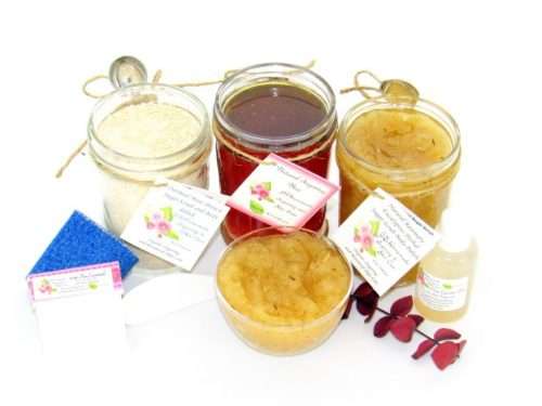 The bundle includes an 8 oz mason jar filled with soft sugaring wax, a jar of Rosemary Eucalyptus Herbal Sugar Body Scrub, and Colloidal Oatmeal Brown Sugar Dry Body Scrub, a small bottle of pure aloe vera, a pouch of cornstarch, denim strips, an applicator, and a glass bowl showcasing the sugar scrub, garnished with sprinkles of rosemary and a sprig of eucalyptus.