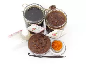 The bundle includes an 8 oz mason jar filled with firm sugaring paste, a jar of Pumpkin Vanilla Brown Sugar Body Scrub, a small bottle of pure aloe vera, a pouch of cornstarch, an applicator, and a glass bowl showcasing the sugar scrub, garnished with a vanilla bean and pumpkin puree.
