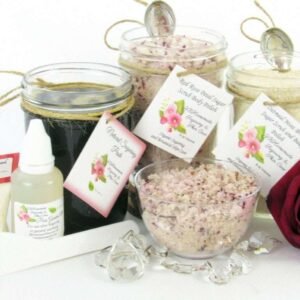 The bundle includes an 8 oz mason jar filled with firm sugaring paste, a jar of Red Rose Petal Sugar Body Scrub, and Colloidal Oatmeal Brown Sugar Dry Body Scrub, a small bottle of pure aloe vera, a pouch of cornstarch, an applicator, and a glass bowl showcasing the sugar scrub, garnished with a red rose bloom.