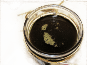 an overhead view of sugaring paste hair removal in a glass mason jar