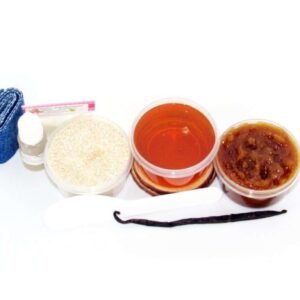 The home sugaring hair removal starter kit comes with a 2 oz tub of soft sugaring wax, a tub of Vanilla Aloe Brown Sugar Body Scrub, a tub of Colloidal Oatmeal Brown Sugar Dry Body Scrub, a small bottle of pure aloe vera, a pouch of cornstarch, denim strips, an applicator, along with a vanilla bean for illustration.