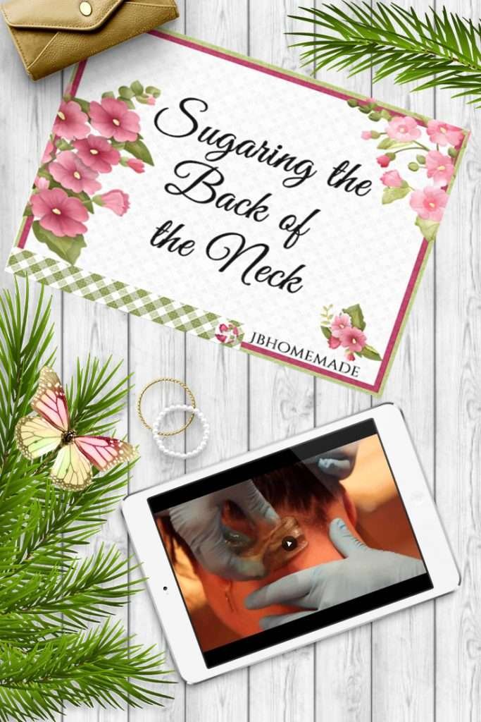 A tablet displaying an image representing the content of 'Sugaring the Back of the Neck' against a grey wood background