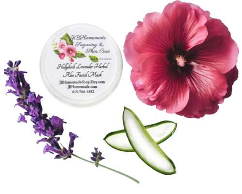 A clay facial mask for radiant skin, handcrafted with garden-fresh ingredients. It contains lavender, hollyhock, and aloe vera. The label on the jar's lid and an overhead view of a dark pink hollyhock flower, a lavender sprig, and two aloe vera slices are shown.