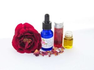 An aesthetically composed image capturing ‘Rose the Age Away’ serum amidst blossoming roses and golden avocado oil.
