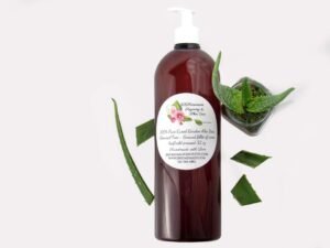 A 32 oz amber pump bottle of Pure Aloe Vera product, enriched and authentic, surrounded by fresh aloe vera leaf pieces, showcasing the natural ingredients and the premium quality of the product.