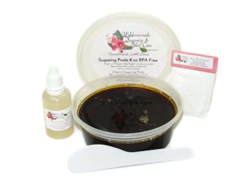 An 8-ounce tub of JBHomemade Sugaring Paste is presented with its included pouch of cornstarch, bottle of aloe vera and applicator.