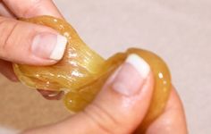 An aesthetician uses her fingers to knead a ball sugaring paste for hair removal, demonstrating the proper size ball to use while preparing it for a treatment that leaves the skin smooth and hair-free.