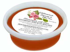 An 8-ounce tub of JBHomemade Sugaring Wax is presented on a white background closeup in the front angled perspective.