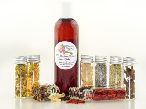 A bottle of Adorn Your Garden Sugaring Cleanser and Prep surrounded by small jars containing its all-natural ingredients like Chamomile, Calendula, Frankincense, Clove, Sandalwood, Lavender, Rosemary, and Ylang Ylang Extra. Front view.