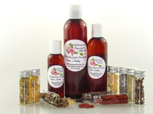 Various sized bottles of Adorn Your Garden Sugaring Cleanser and Prep surrounded by small jars containing its all-natural ingredients like Chamomile, Calendula, Frankincense, Clove, Sandalwood, Lavender, Rosemary, and Ylang Ylang Extra. Front view.
