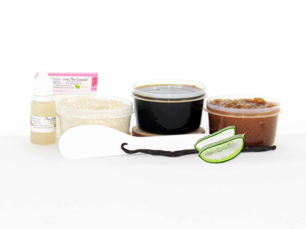 The home sugaring hair removal starter kit comes with a 2 oz tub of firm sugaring paste, a tub of Vanilla Aloe Brown Sugar Body Scrub, a tub of Colloidal Oatmeal Brown Sugar Dry Body Scrub, a small bottle of pure aloe vera, a pouch of cornstarch, an applicator, along with a vanilla bean and a slice of aloe plant for illustration.