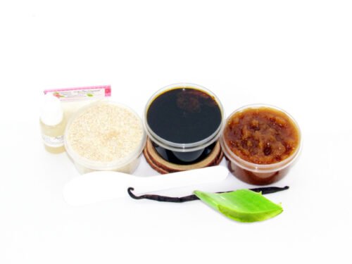 The home sugaring hair removal starter kit comes with a 2 oz tub of firm sugaring paste, a tub of Vanilla Aloe Brown Sugar Body Scrub, a tub of Colloidal Oatmeal Brown Sugar Dry Body Scrub, a small bottle of pure aloe vera, a pouch of cornstarch, an applicator, along with a vanilla bean and a slice of aloe plant for illustration.